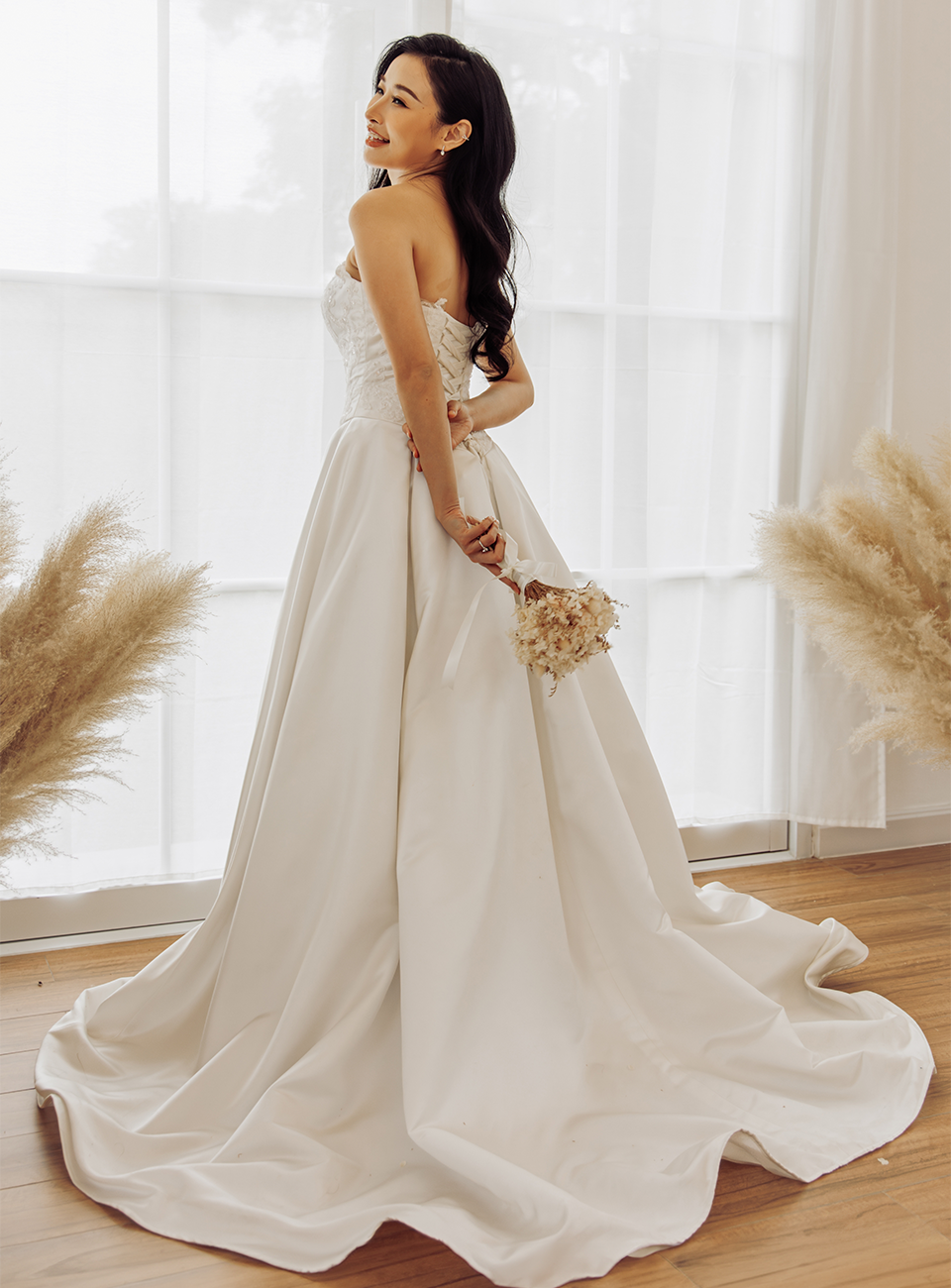 Bride standing in a white wedding dress Bride standing in a white wedding dress