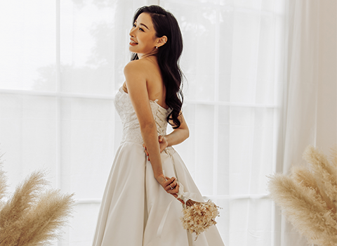 Bride standing in a white wedding dress Bride standing in a white wedding dress