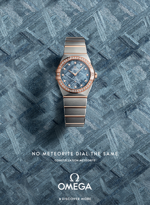 Banner with an Omega Speedmaster Moonwatch on a clean gray background